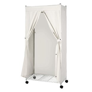 Portable garment rack with outlet cover